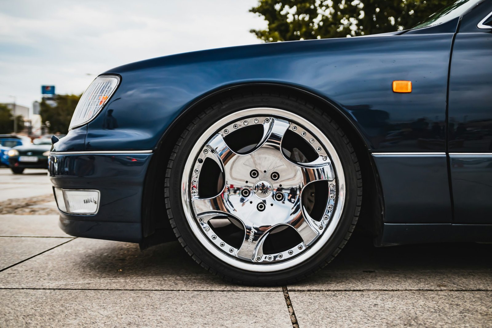 blue car with chrome wheel